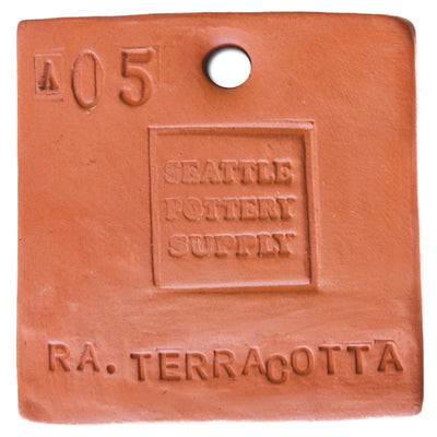 Red terracotta sample tile stamped with the Seattle Pottery Supply logo, cone 05, and Redart Terracotta