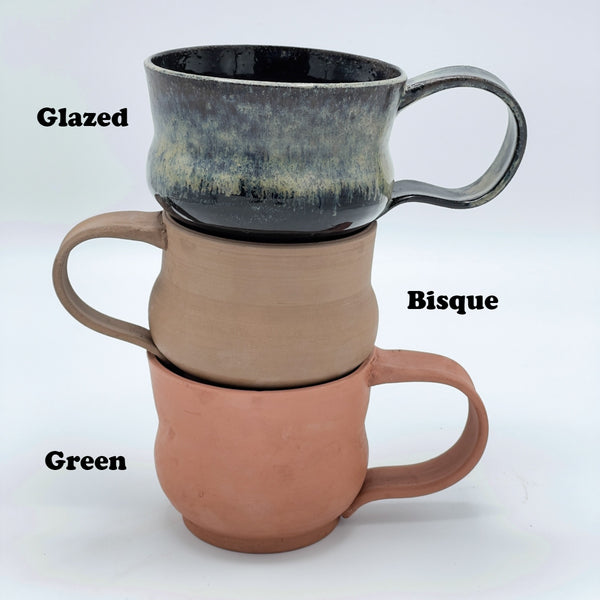 3 Stacked Mugs in 3 different stages firing, made of Eclipse black clay ceramic ware; Glazed, Bisque, & Green