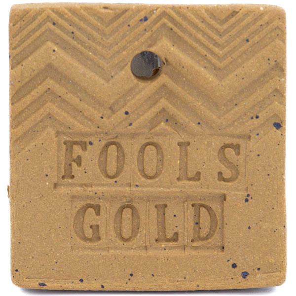 A test tile of Seattle Pottery Supply's Fool's Gold Speckled Pottery Clay